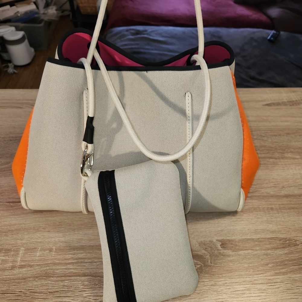 Haute Shore Greyson Riot Neoprene Tote Bag with a matching zippered wristlet pou